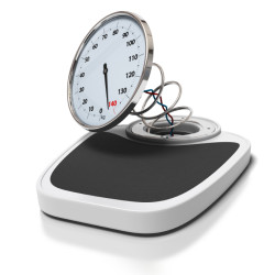broken bathroom scales over a white background - overweight concept - square images